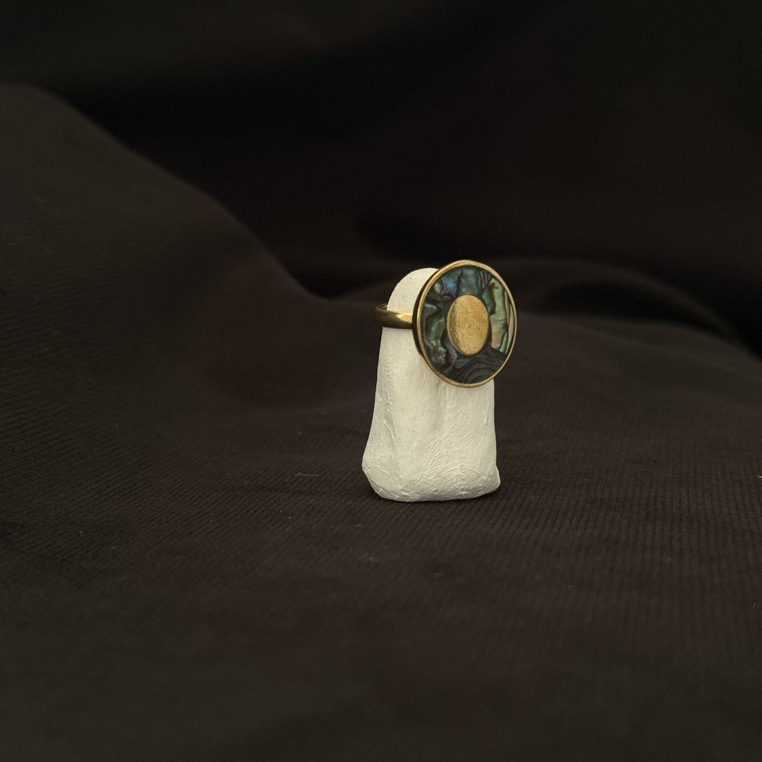 Round brass statement ring with abalone shell and central oval detail