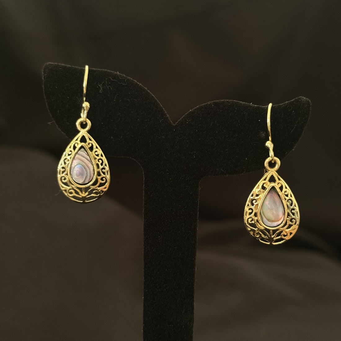 Petite ornate brass teardrop earrings with abalone shell