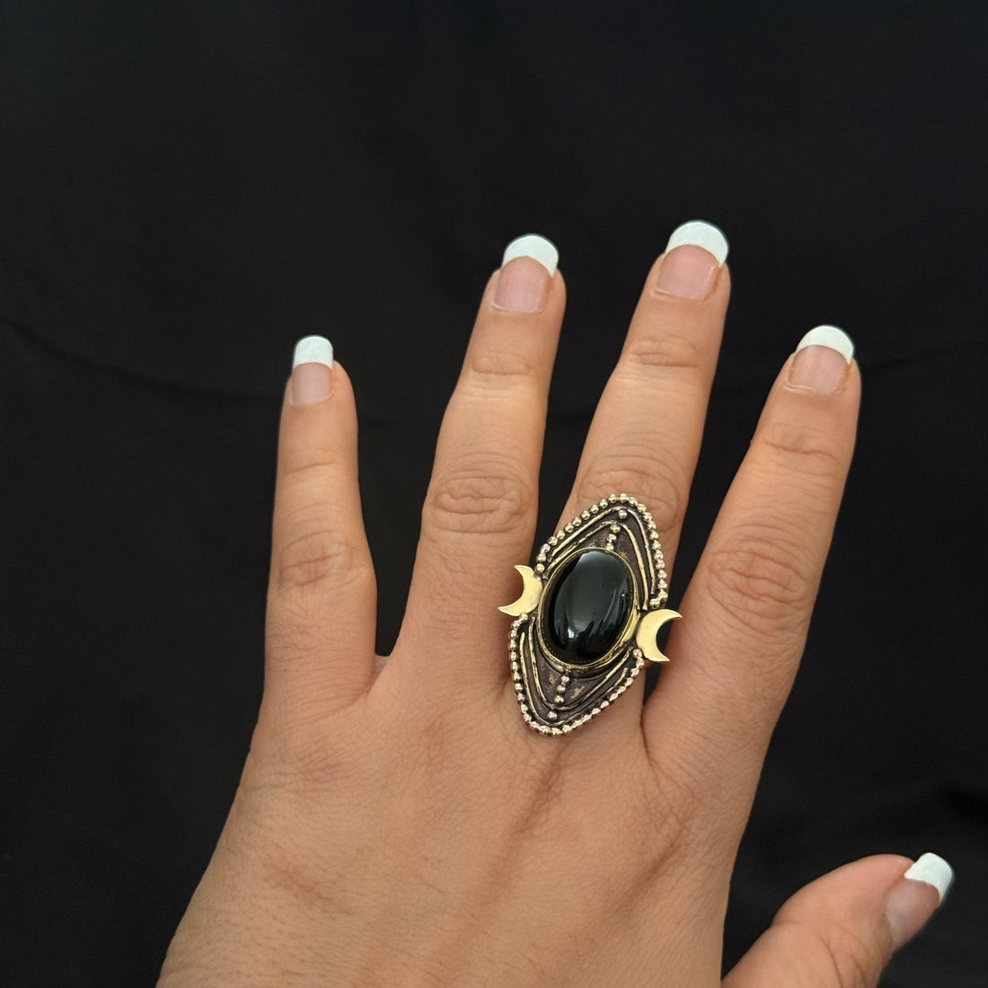Black stone lunar statement ring with crescent details