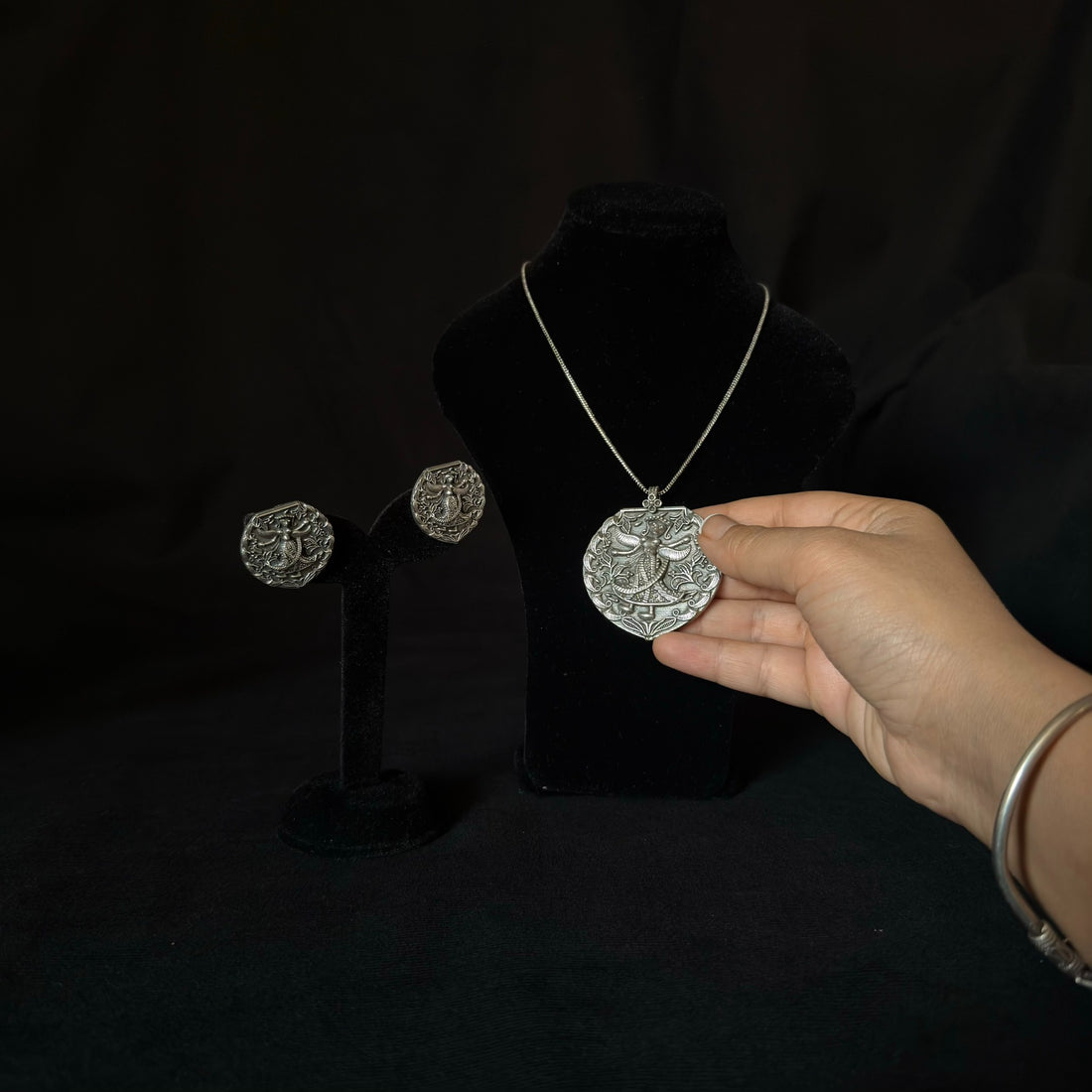 Oxidized brass figurative medallion necklace set with matching earrings