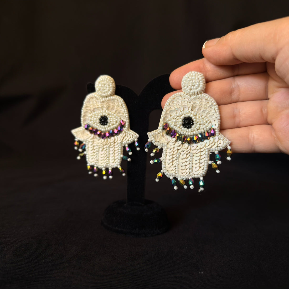 Handmade ivory Hamsa beaded statement earrings with iridescent crystal fringe