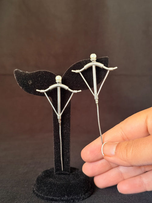 Pearl bow long pin earrings