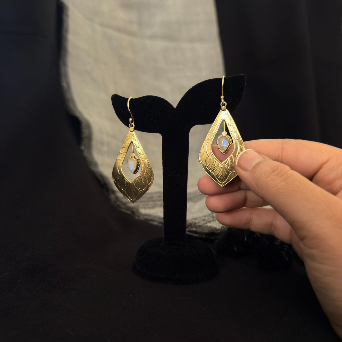 Leaf drop earrings with iridescent white stones