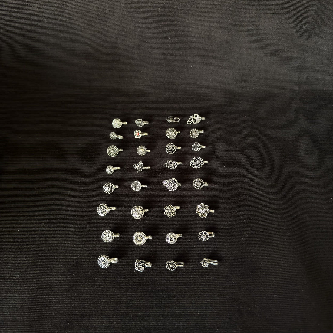 Full assortment of silver-tone clip-on nose and ear cuff designs