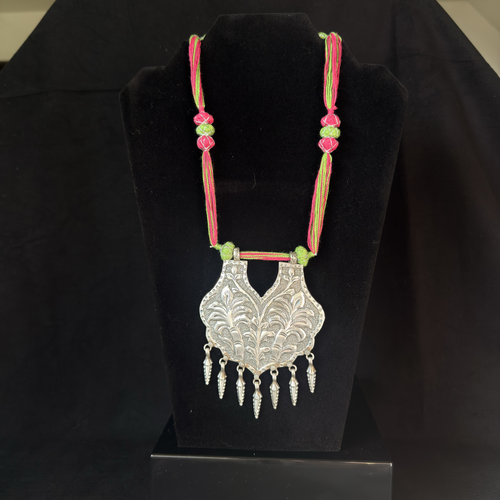 Botanical shield oxidized brass statement necklace with pink and green thread