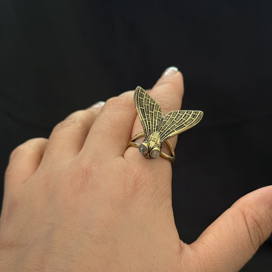 Cicada statement ring with pale stone eyes