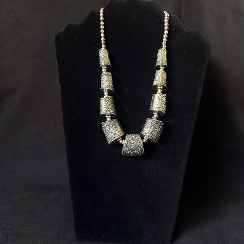 Sculptural oxidized metal panel statement necklace
