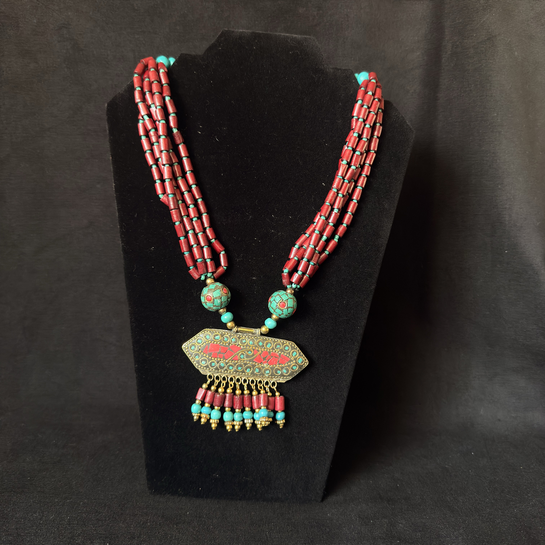 Red turquoise colored multistrand pendant necklace
